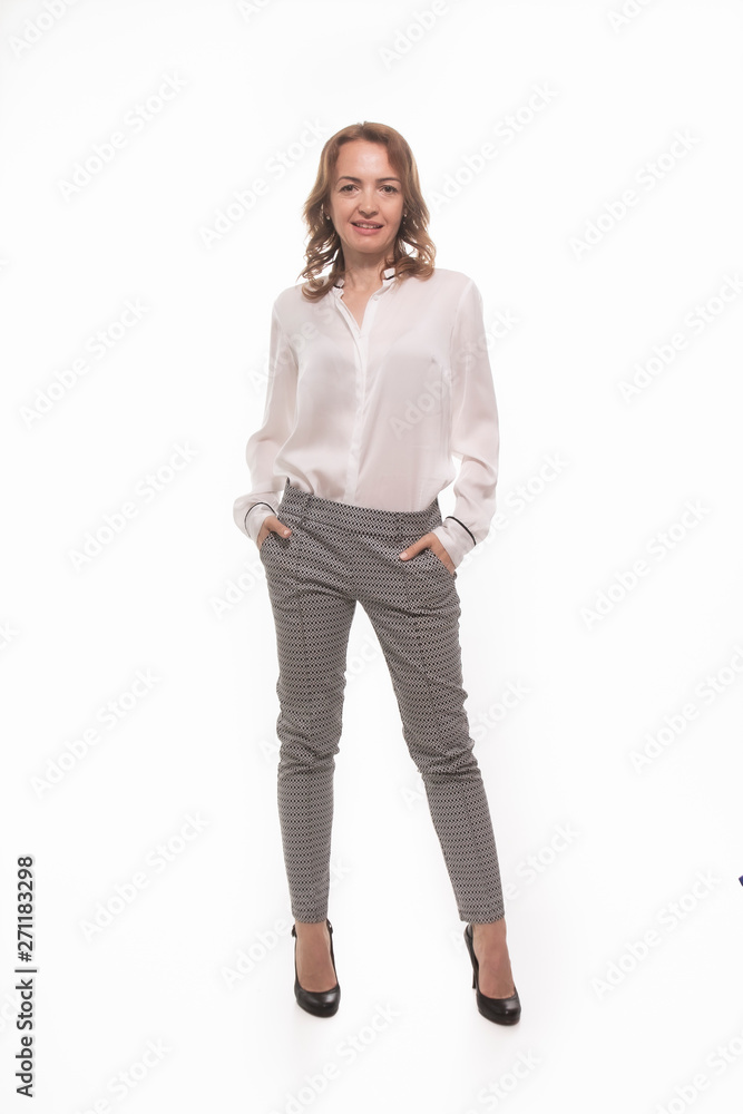One mature woman, 40 years old, businesswoman portrait posing, full length. One mature woman, 40 years old, businesswoman portrait posing, full length.