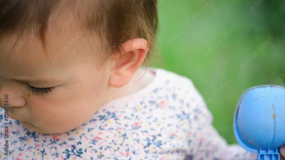 Close up of happy caucasian child outdoor in green grass activity Close up of happy caucasian child outdoor in green grass activity