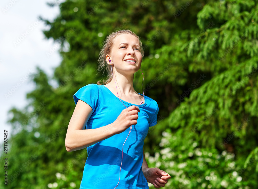 Young fitness woman running at forest trail. Young fitness woman running at forest trail.
