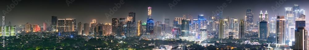 Panoramic Jakarta skyline with urban skyscrapers at night