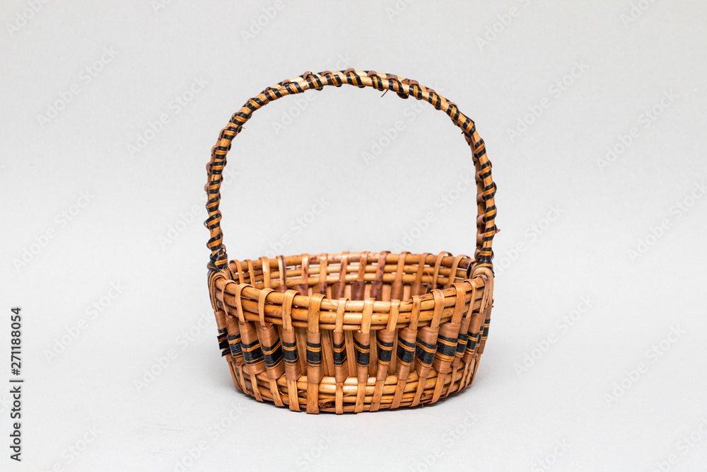 Empty wicker basket isolated on white background. High resolution photo.