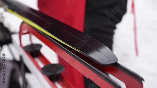 Lubrication of cross-country skis for better sliding in the snow, close-up. Cross-country skiing preparation for competitions