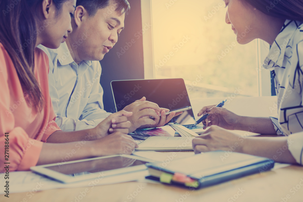 Discussing plan and idea to improvement strategy, businessmen brainstorming for strategy of business investment,businessmen review chart and document of investment information Discussing plan and idea to improvement strategy, businessmen brainstorming for strategy of business investment,businessmen review chart and document of investment information