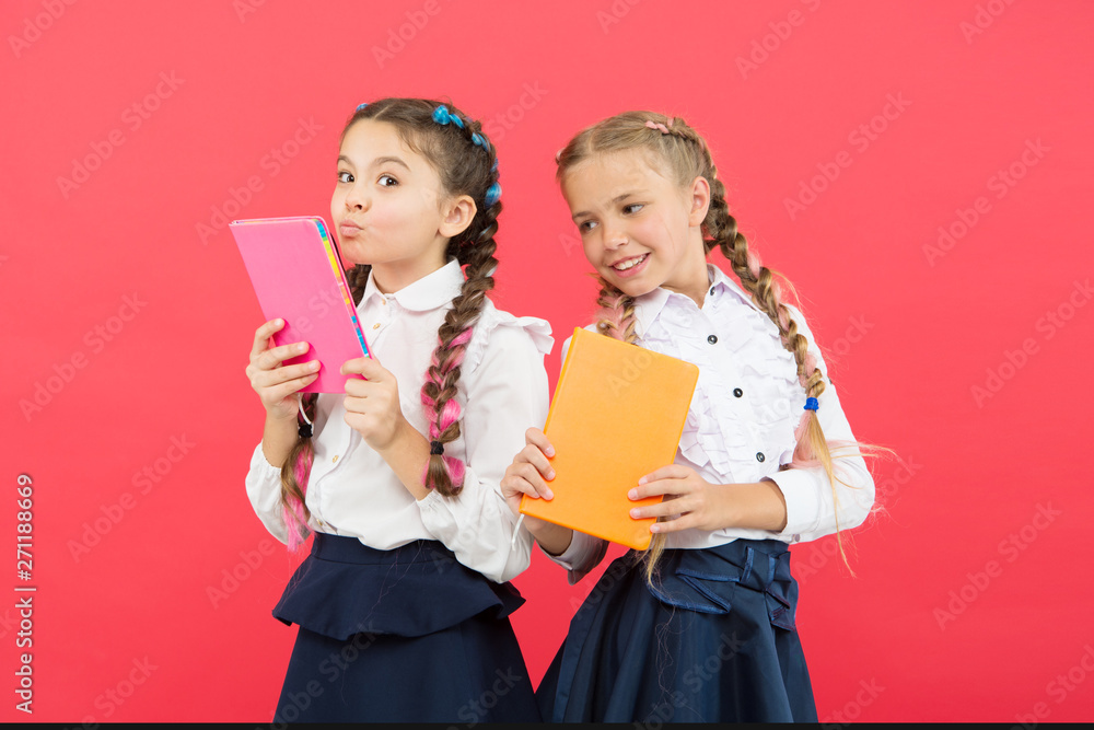 Read every day. Cute small children holding books to read on red background. Adorable little girls learning to read at school. Enter a different world, read Read every day. Cute small children holding books to read on red background. Adorable little girls learning to read at school. Enter a different world, read