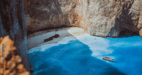 Navagio beach panoramic shot in moody vintage waved bay water and abandoned shipwreck on shore. Zakynthos Island, Greece