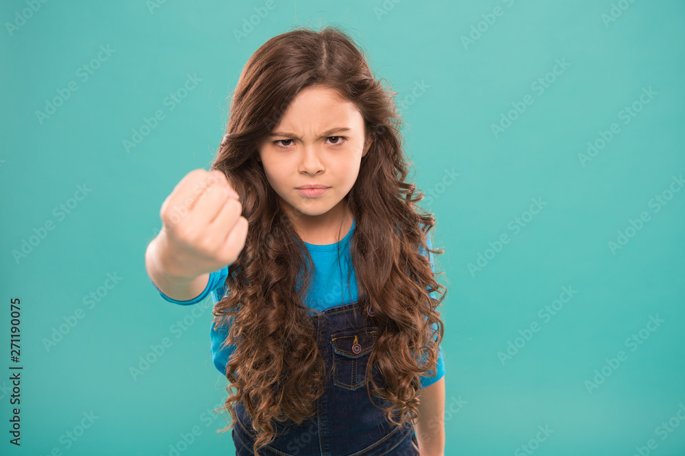 Painful punch. Serious child threatening. Punch you in face. Stop bullying movement. Girl threatening with fist. Threatening physical attack. Aggression concept. Aggressive girl threatening to beat Painful punch. Serious child threatening. Punch you in face. Stop bullying movement. Girl threatening with fist. Threatening physical attack. Aggression concept. Aggressive girl threatening to beat