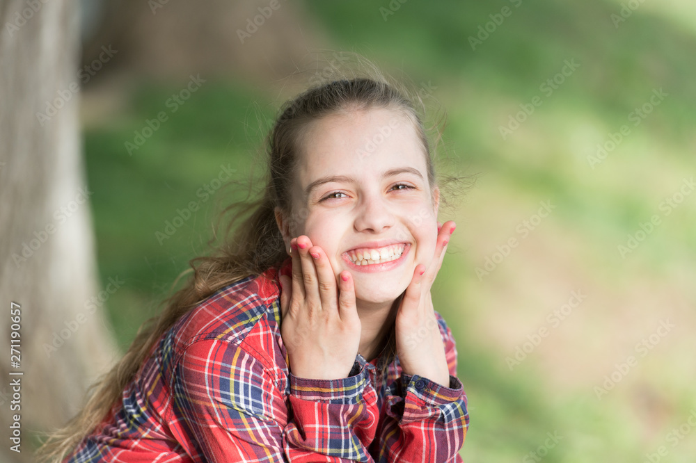 A healthy smile begins with a child. Smiling kid with white healthy smile on beautiful face. Cute small child with long blond hair and happy smile. Adorable little girl with big smile