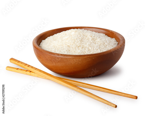 A wooden bowl with white rice and food chopsticks. Natural products, healthy food.