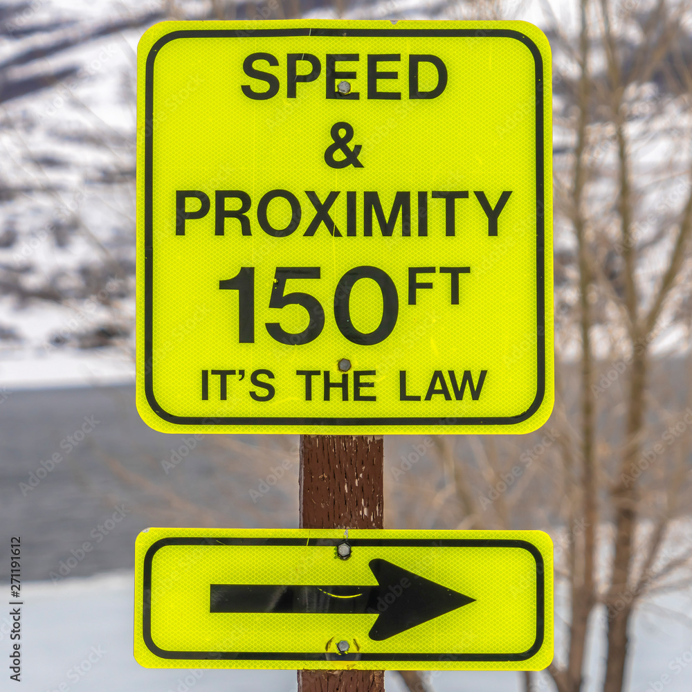 Square frame Close up of a bright yellow Speed and Proximity road sign with arrow Square frame Close up of a bright yellow Speed and Proximity road sign with arrow