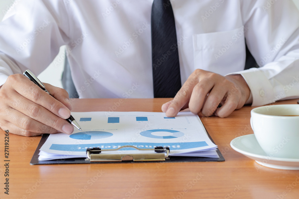 Fototapeta premium business hands checking a data paper