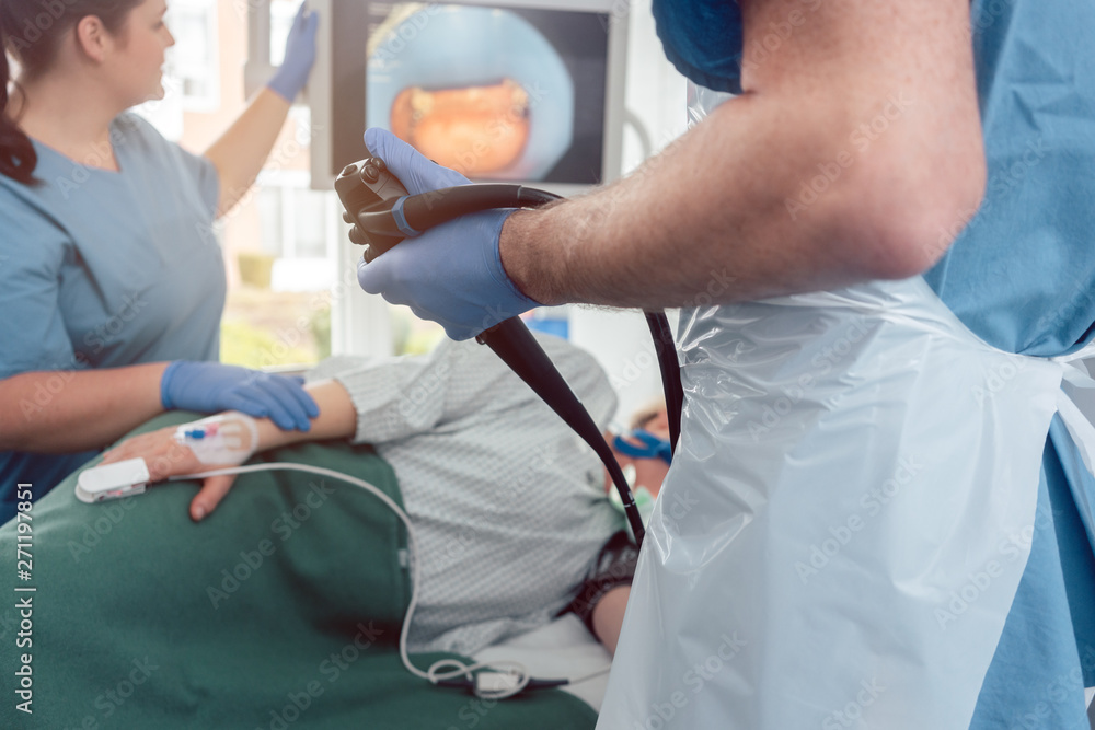 Doctor during endoscopy checking picture of mouth on screen Doctor during endoscopy checking picture of mouth on screen