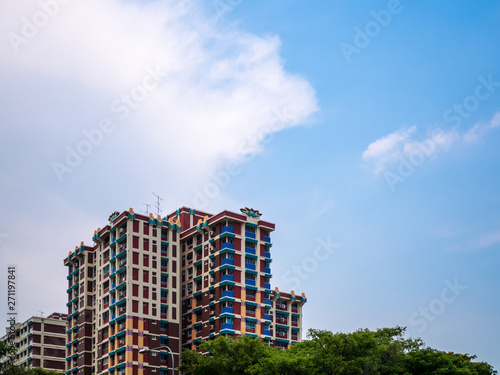 Scenic view of government built public housing in Singapore (HBD flats) against the blue sky.