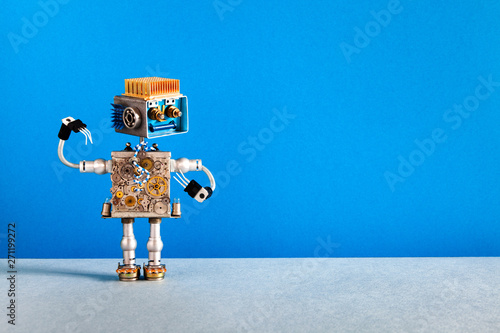 Mechanical robot cheerful face, cogs wheels machine parts body. Creative design robotic toy on blue gray background. copy space photo