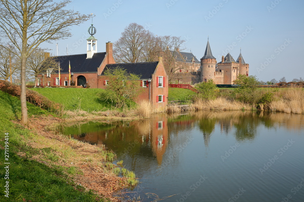 Fototapeta premium Reflections of Muiderslot Castle, a medieval castle located in Muiden, Netherlands