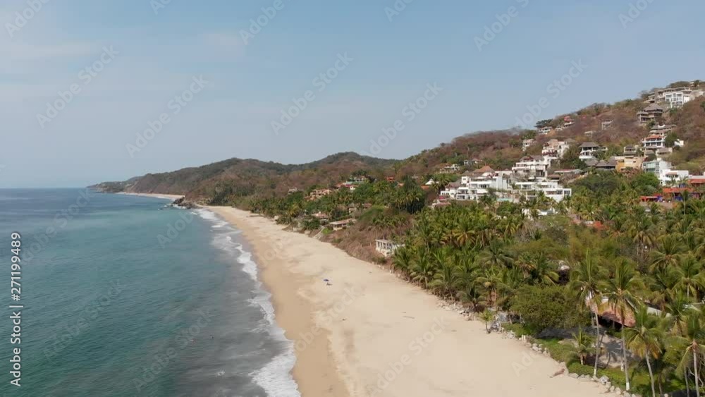 Aerial shot of beach in Sayulita Mexico showing beach and hillside on a sunny day. Aerial shot of beach in Sayulita Mexico showing beach and hillside on a sunny day.