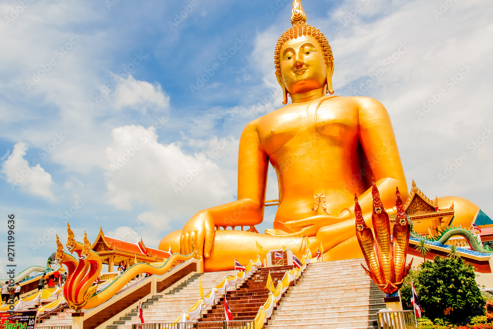 Obraz premium Big Golden Buddha with blue sky blue at Wat Muang, Ang Thong Province, Thailand