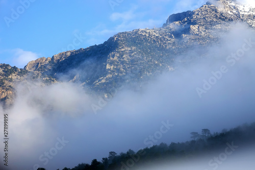 close up fogy mountains and forest over sunny and cloudy morning sky in Kayseri, Turkey