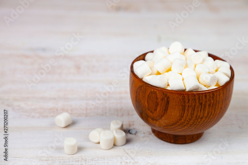 Marshmallow in a wooden bowl