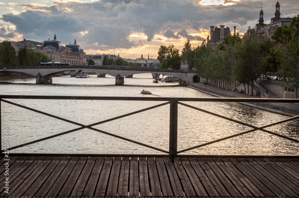 Sunset landscape on the Seine River in Paris from the Pont des Arts