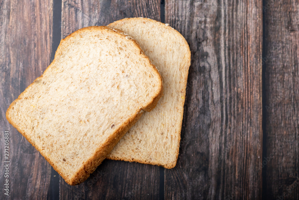 Whole wheats breads on the wooden Whole wheats breads on the wooden