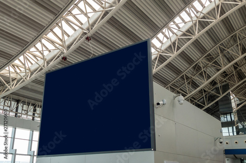 Blank large billboard with camera cctv in the airport
