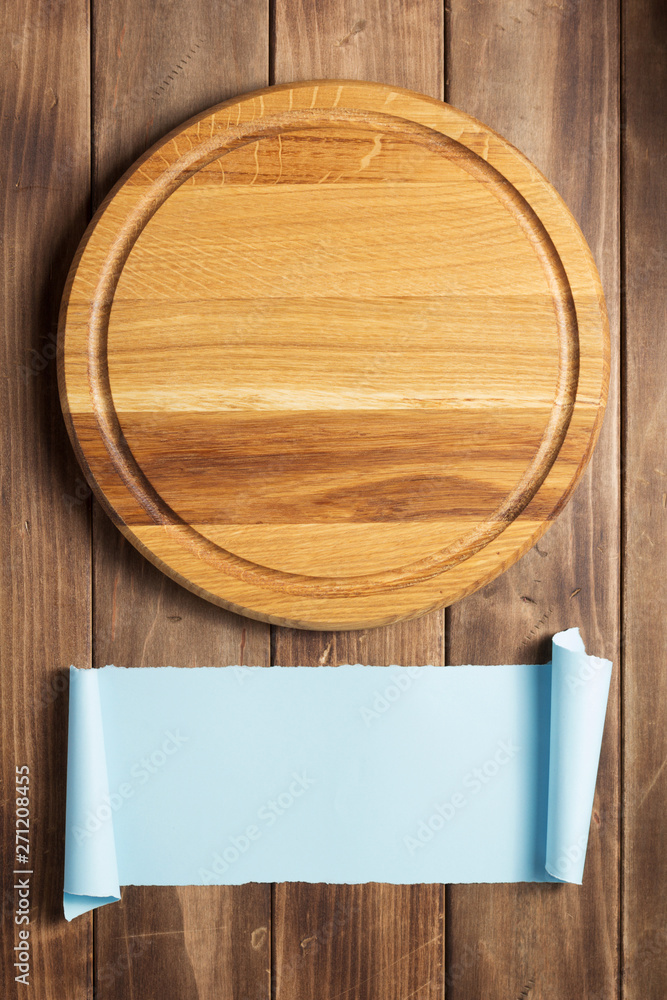 pizza cutting board at rustic wooden plank background pizza cutting board at rustic wooden plank background