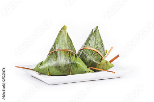 Fresh dumplings wrapped in glutinous rice leaves / traditional festival food for Chinese Dragon Boat Festival photo