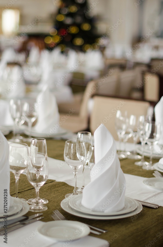 Shot of napkins and wine glasses banquet table at luxury restaurant