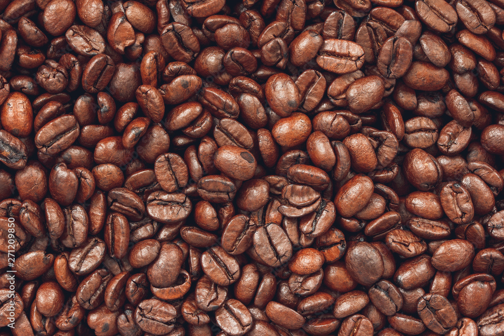 Obraz premium Macro photo of roasted coffee beans background