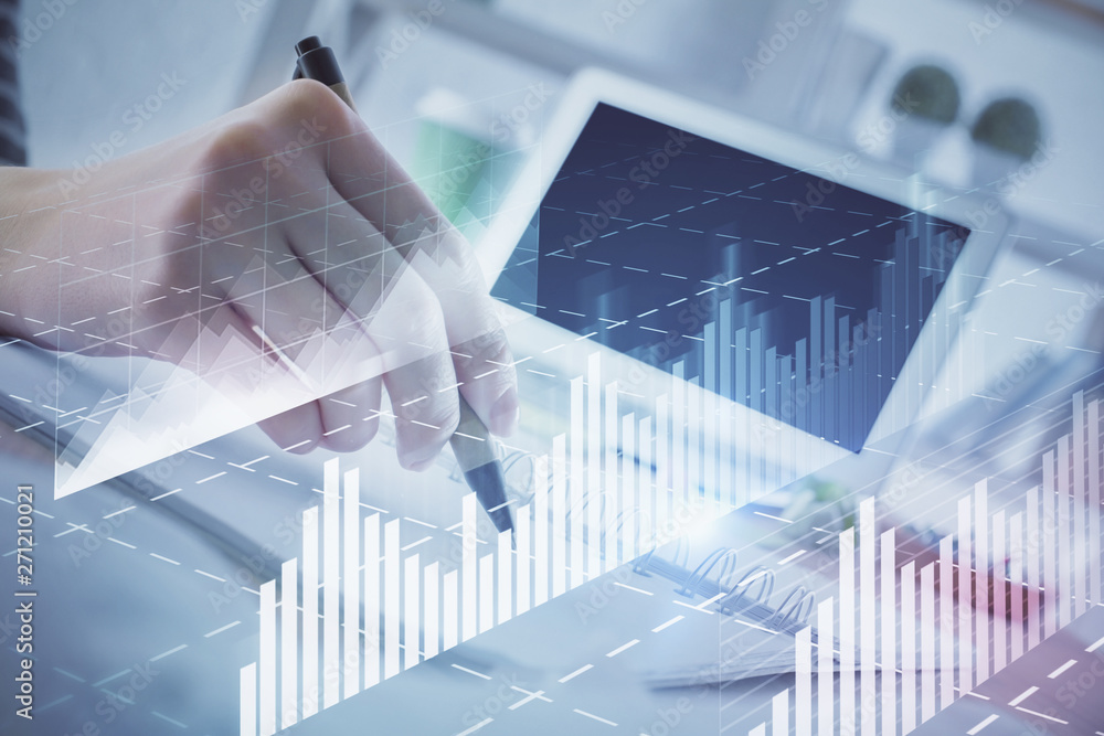 Financial forex graph drawn over hands taking notes background. Concept of research. Multi exposure Financial forex graph drawn over hands taking notes background. Concept of research. Multi exposure