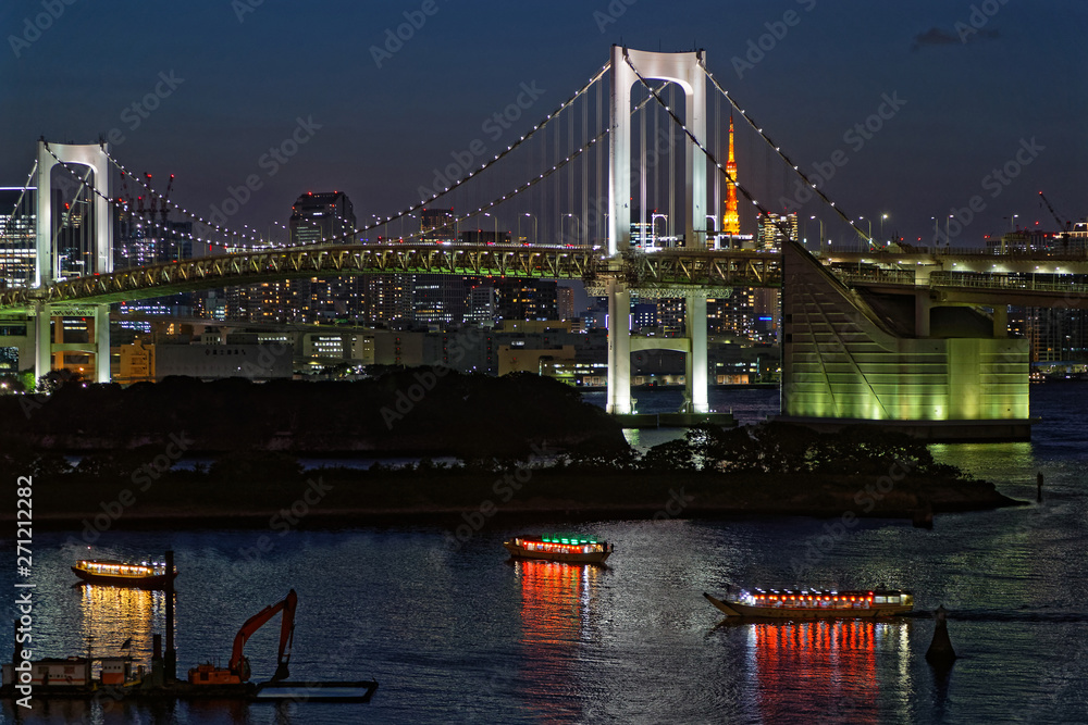 TOKYO, JAPAN, May 17, 2019 : Night on Rainbow Bridge in Odaiba. The Greater Tokyo Area is ranked as the most populous metropolitan area in the world.
