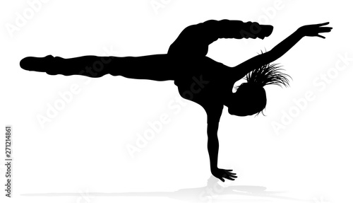 A woman street dance hip hop dancer in silhouette