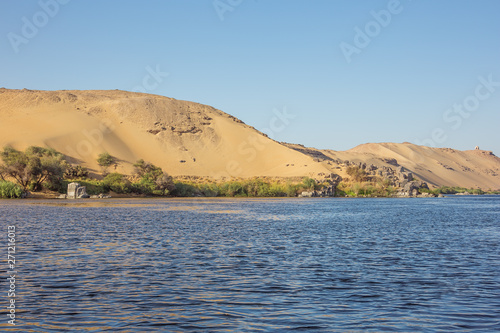 The desert with the shore of the Nile close to Aswan photo