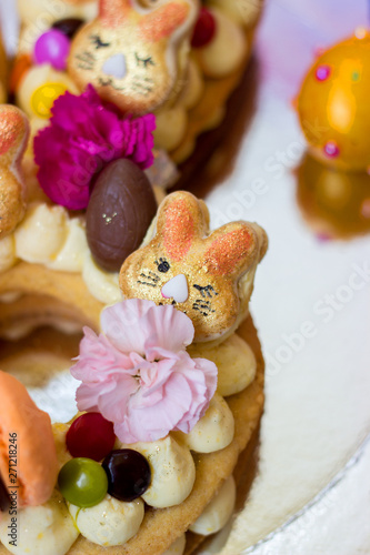 Details of a Easter cake  - Vanilla cake decorated with macaroons and flowers