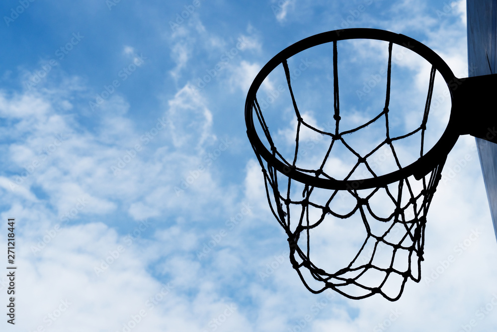 silhouette basketball hoop with blue white cloud sky sport background