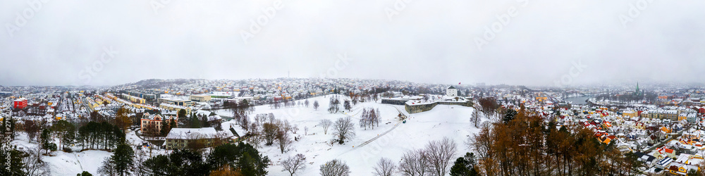 Panoramic aerial view of the city center in winter in Trondheim, Norway with heavy snow