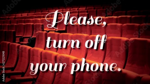A cute text message falling from the ceiling and dissolving, over an angled shot of chairs in a cinema: please turn off your phone.