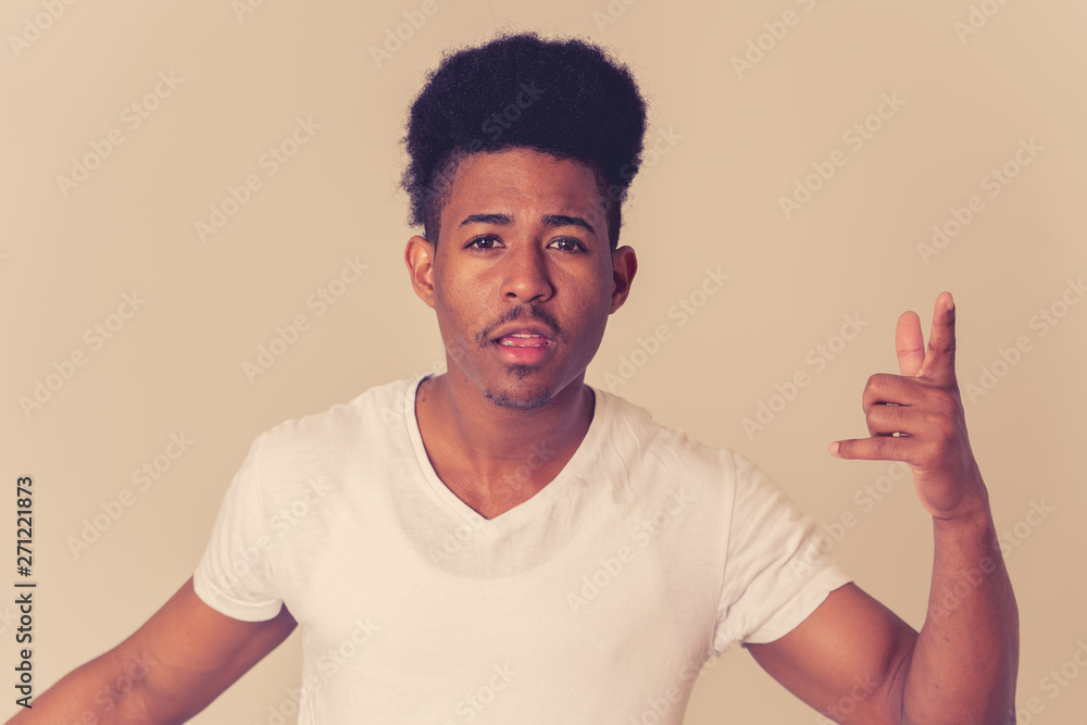 Human expressions and emotions. Young attractive man with an angry face, looking furious and crazy Human expressions and emotions. Young attractive man with an angry face, looking furious and crazy