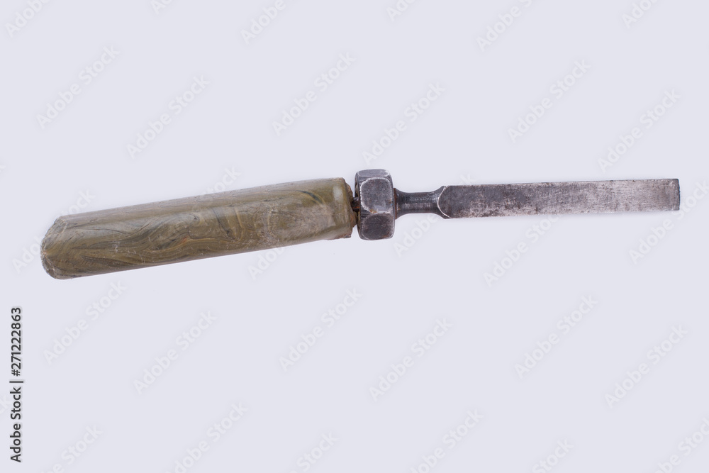 Chisel isolated on white background. Used tool with rubber handle. Instrument for carpenter.