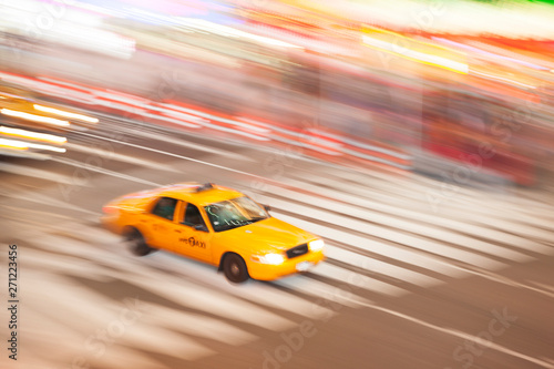 Panning image of a Yellow Taxi cab in Times Square, New York City. New York. USA