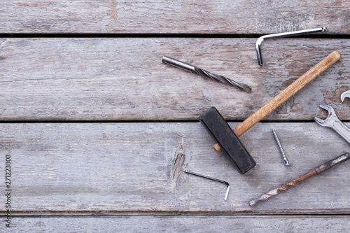 Old construction tools on rustic background. Set of different repair tools on wooden background with copy space.