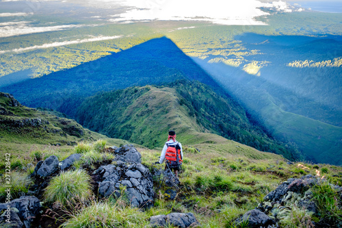 Trekking down in the shadow of Mount Rinjani's peak, Lombok, Indonesia