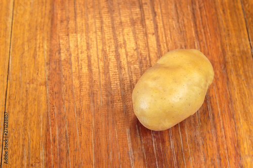potato on wooden table.