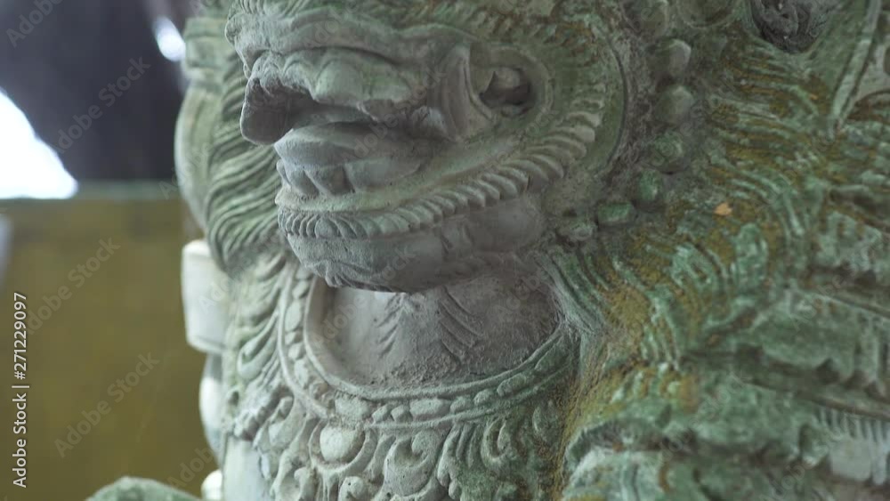 Indonesia god statue in front Bali temple, Indonesia. Traditional indonesian hindu symbol. Ancient sculpture religious idol. Balinese spiritual architecture. Asian culture. Tourism and travel concept. Indonesia god statue in front Bali temple, Indonesia. Traditional indonesian hindu symbol. Ancient sculpture religious idol. Balinese spiritual architecture. Asian culture. Tourism and travel concept.
