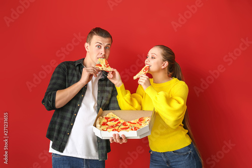 Young couple eating tasty p...