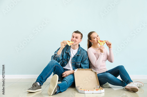 Young couple eating tasty p...