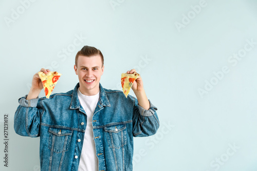 Handsome man with tasty piz...