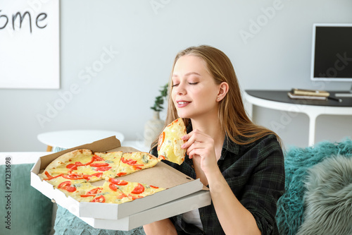 Beautiful woman eating tast...