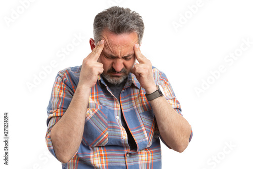 Man with headache touching temples