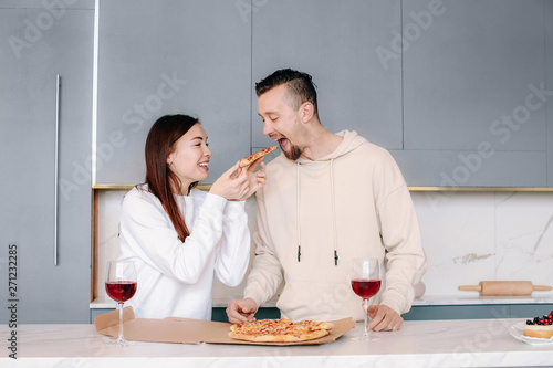 Happy couple drinking wine ...